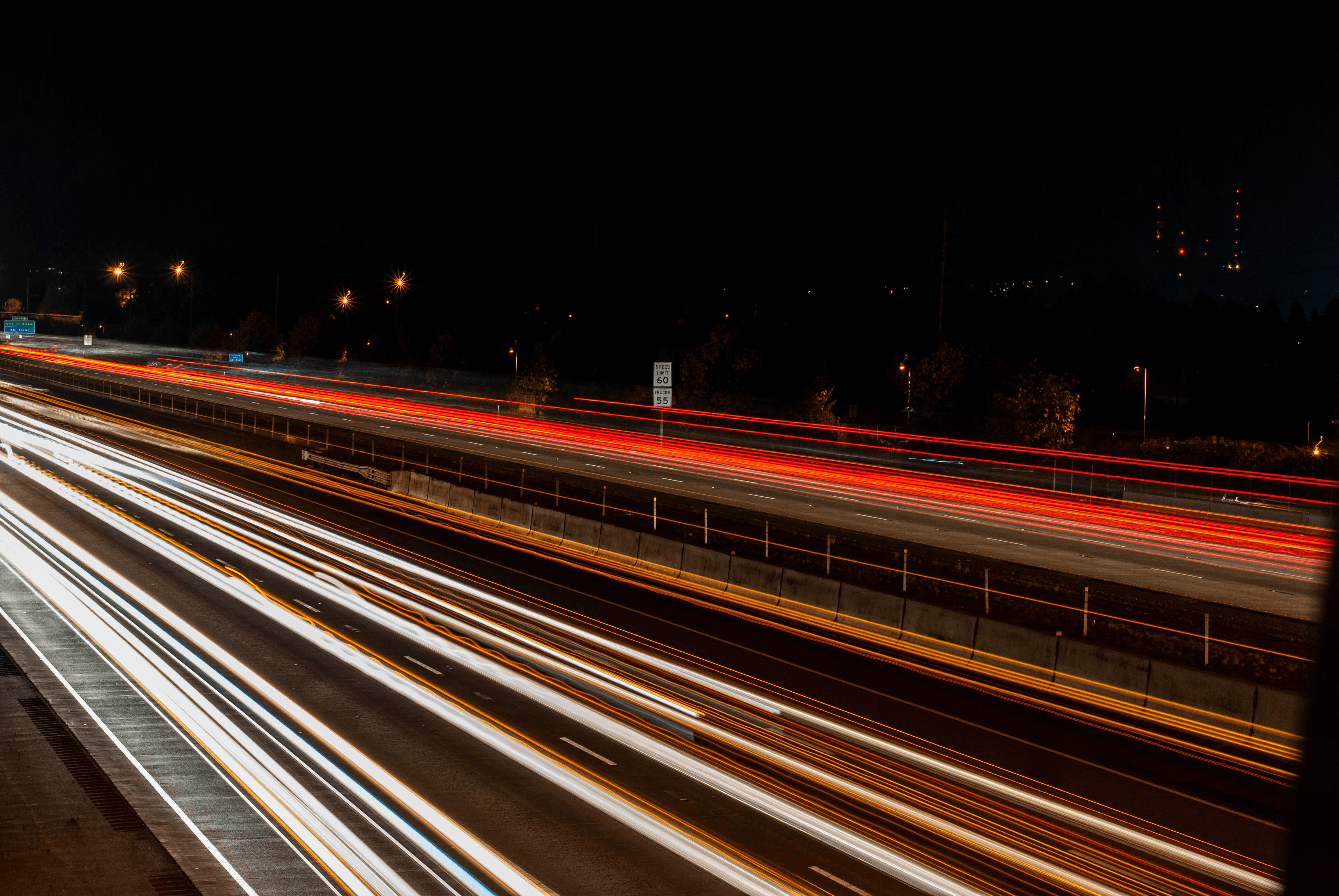 A photograph of the motion of cars on a highway using the representation of lights.